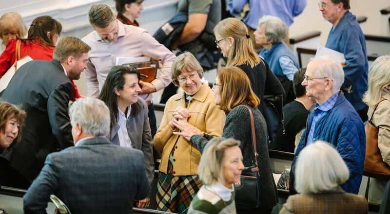 photo of congregation greeting one another after church